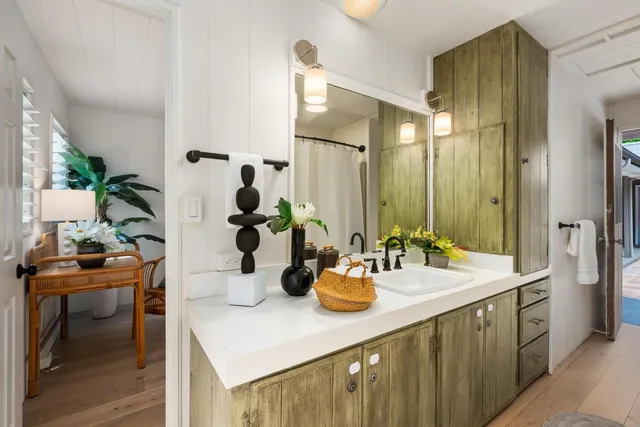 a bathroom with a sink double vanity and a mirror