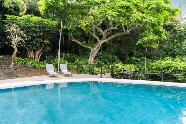 a view of a patio with a table and chairs