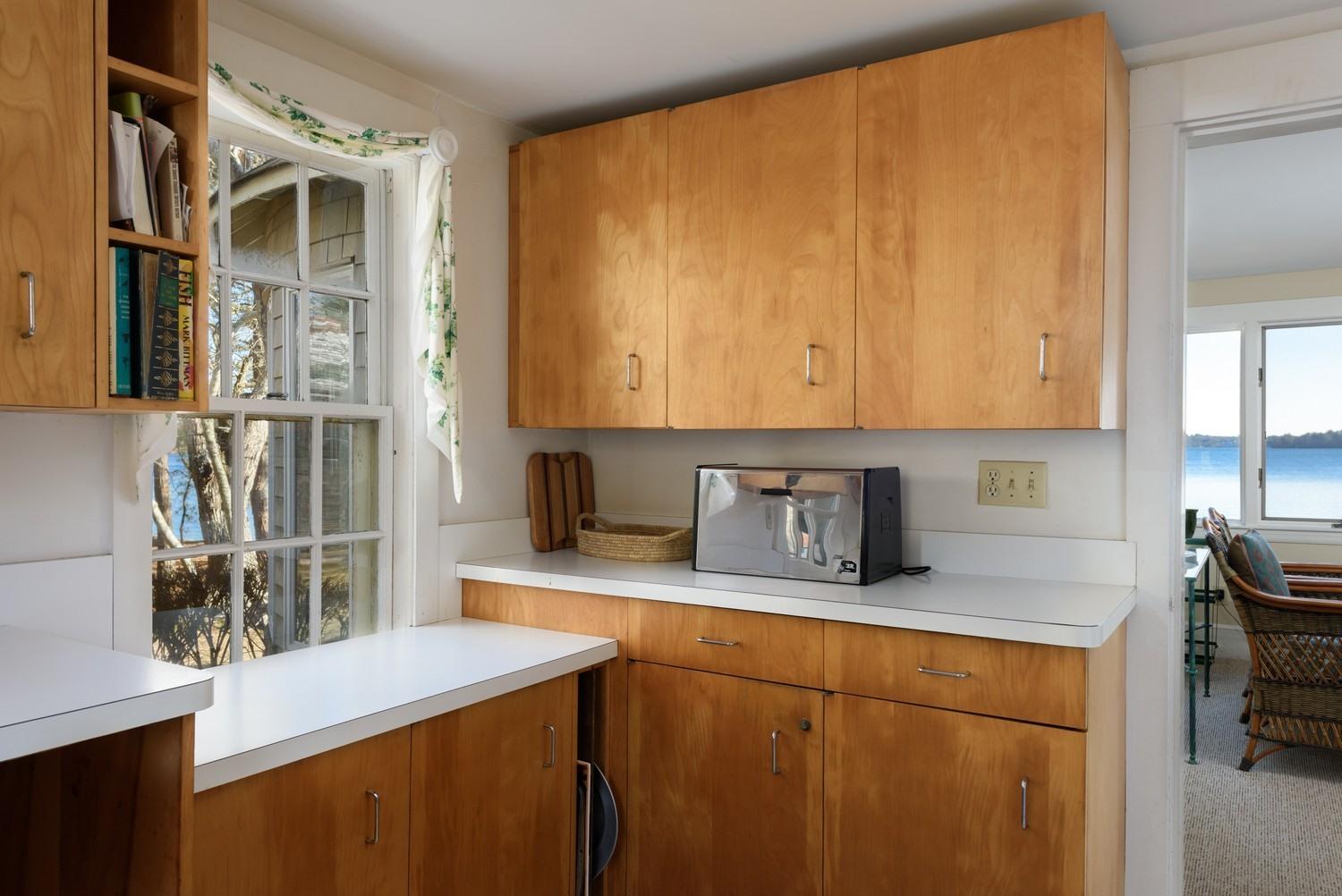 16 Lakeview Drive Centerville, MA 02632 - Photo 16 of 34 a kitchen with stainless steel appliances a sink a stove and a refrigerator