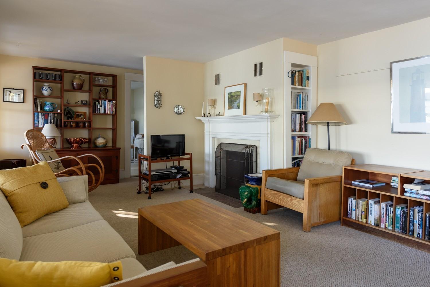 16 Lakeview Drive Centerville, MA 02632 - Photo 19 of 34 a living room with furniture and a fireplace