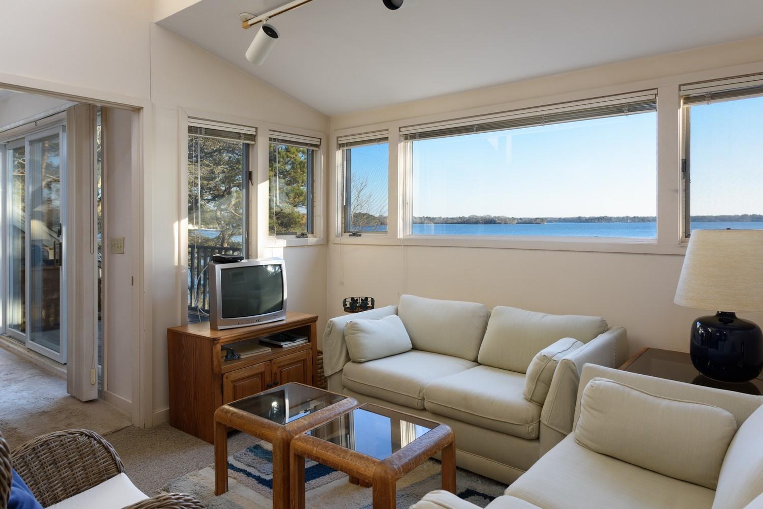 16 Lakeview Drive Centerville, MA 02632 - Photo 22 of 34 a living room with furniture a flat screen tv and a window