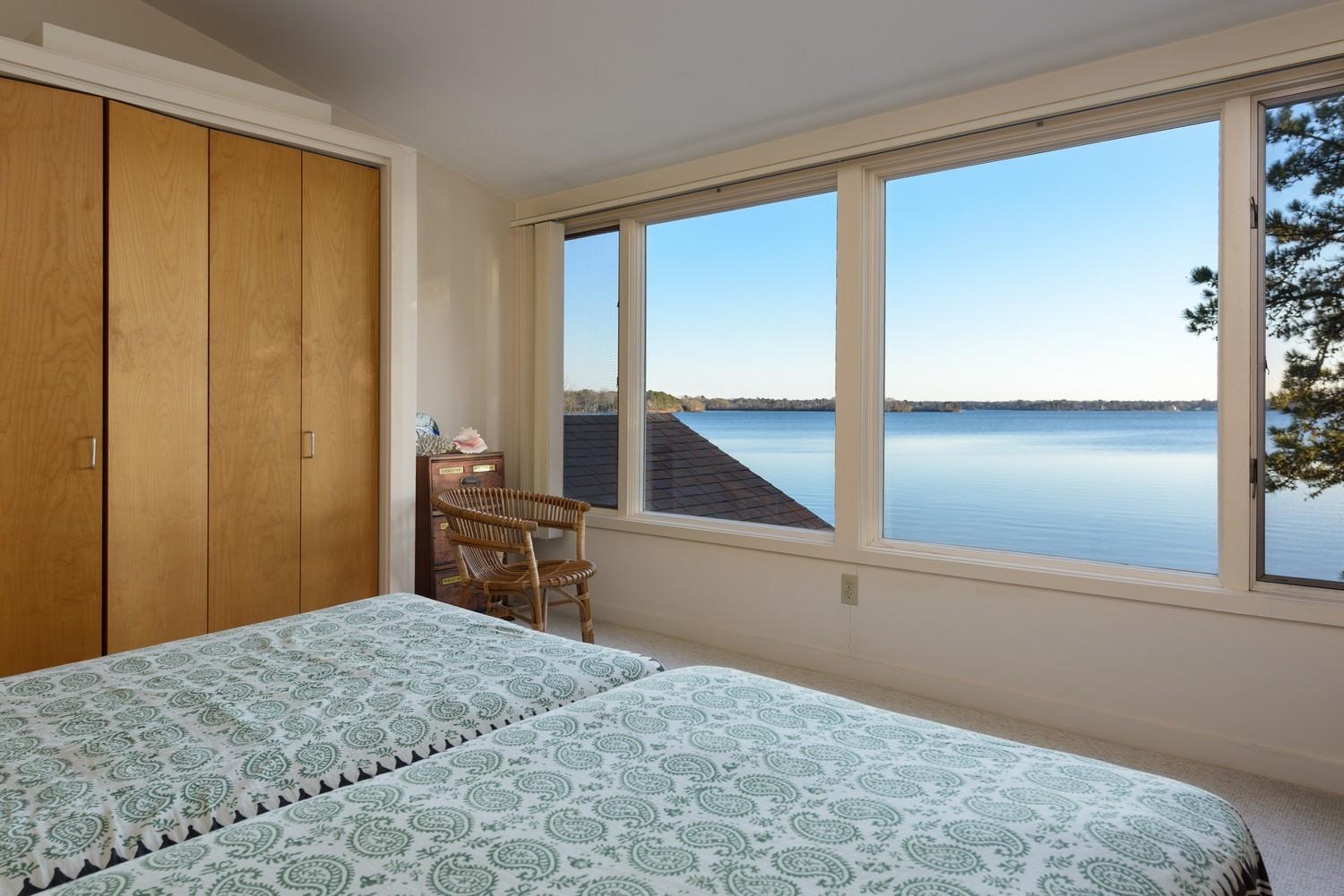 16 Lakeview Drive Centerville, MA 02632 - Photo 23 of 34 a bedroom with a bed and wooden floor