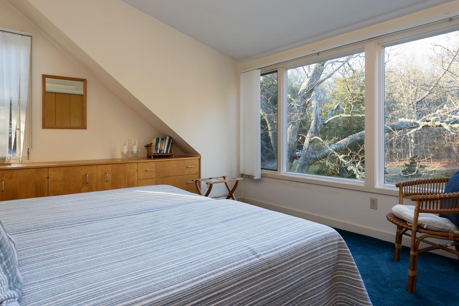 16 Lakeview Drive Centerville, MA 02632 - Photo 24 of 34 a bedroom with a bed and a large window