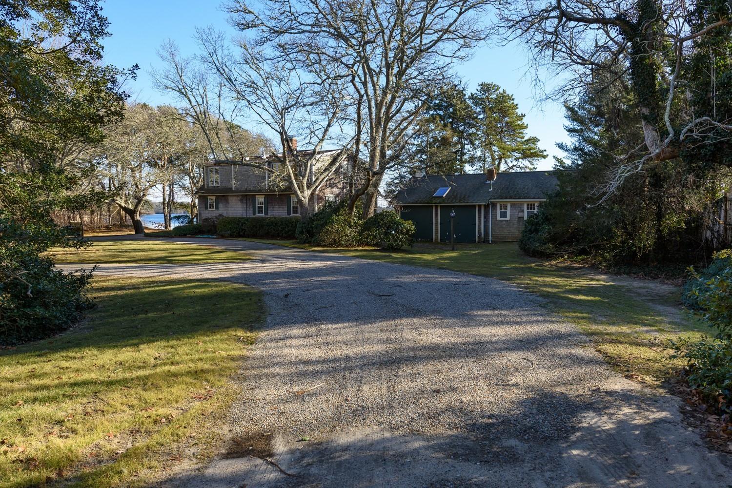 16 Lakeview Drive Centerville, MA 02632 - Photo 4 of 34 a view of street with large trees