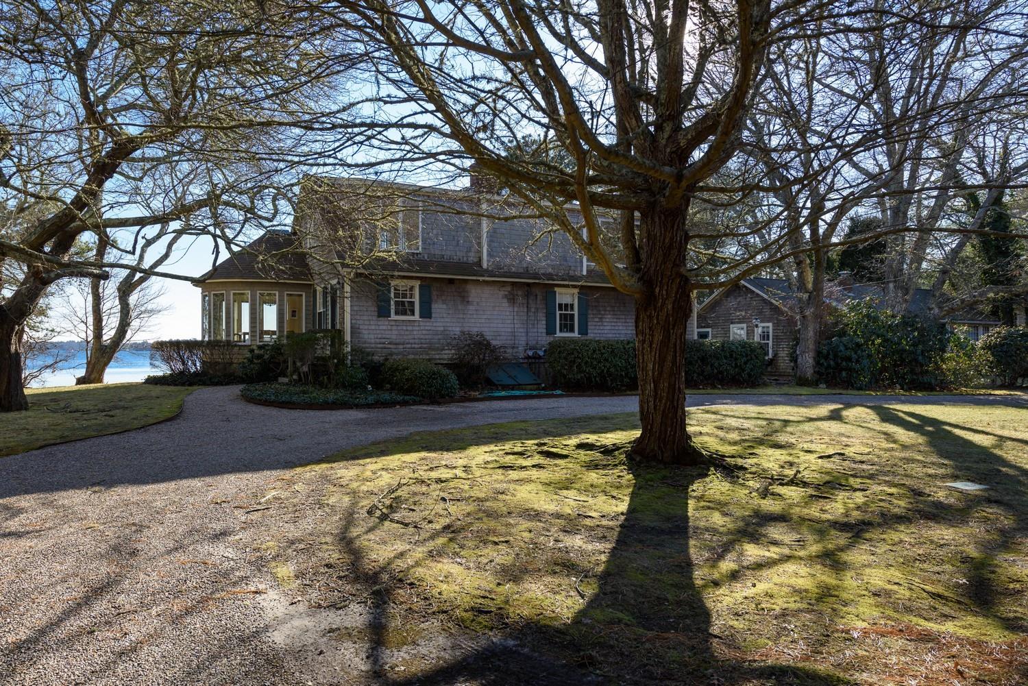 16 Lakeview Drive Centerville, MA 02632 - Photo 8 of 34 a front view of house with yard and trees around