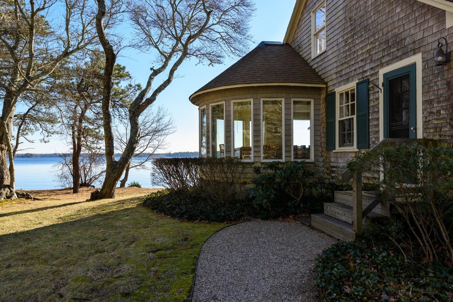 16 Lakeview Drive Centerville, MA 02632 - Photo 9 of 34 a front view of a house with a yard
