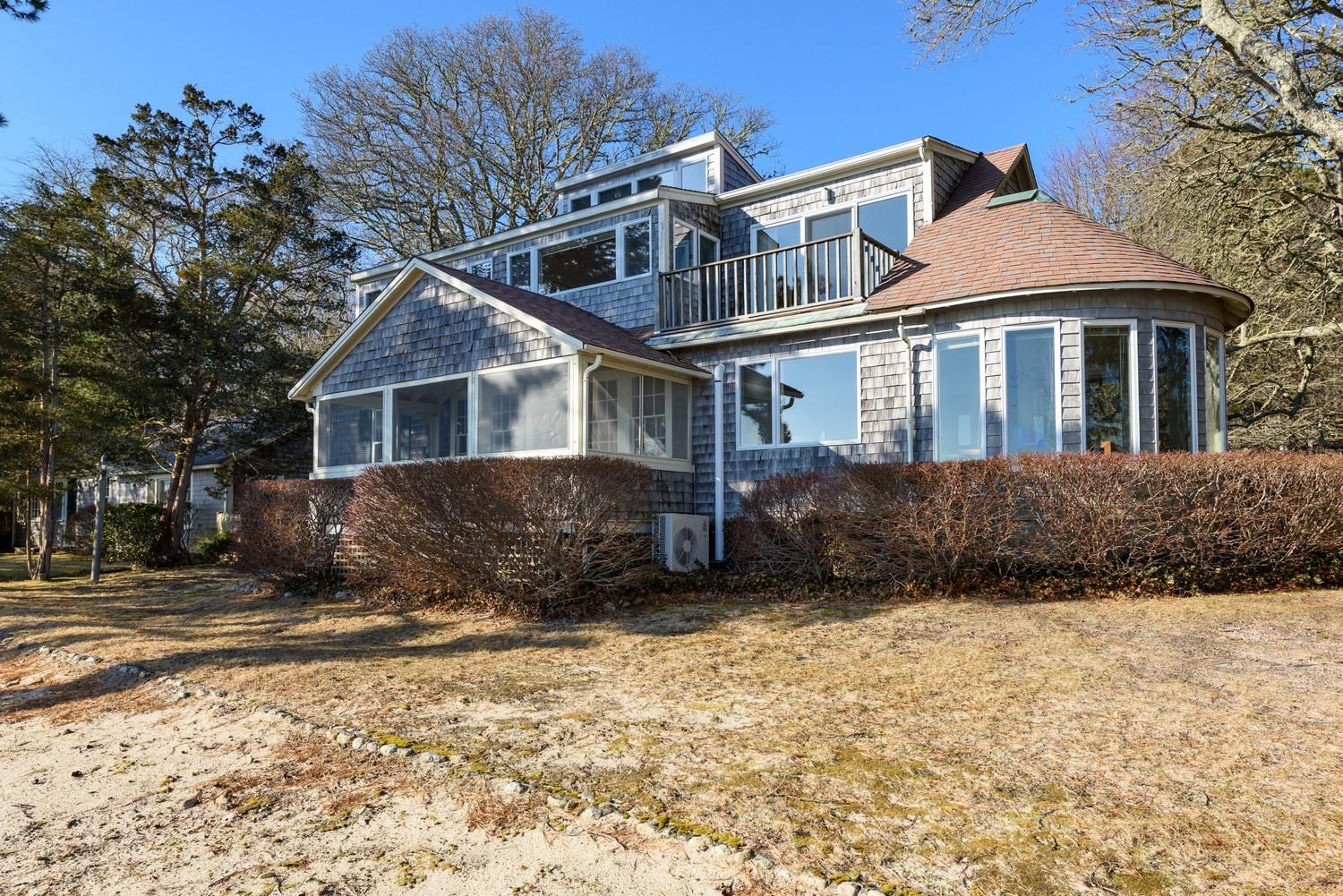 16 Lakeview Drive Centerville, MA 02632 - Photo 10 of 34 a front view of a house with a yard covered in snow
