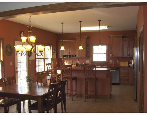 1525 Dutch Ridge Road Beaver, PA 15009 - Photo 4 of 15 Kitchen. Cherry Cabinets. Huge walk in Pantry with Pocket door. Two sinks. Trash plus recyclable bins. Opens to the deck. Corian counter tops