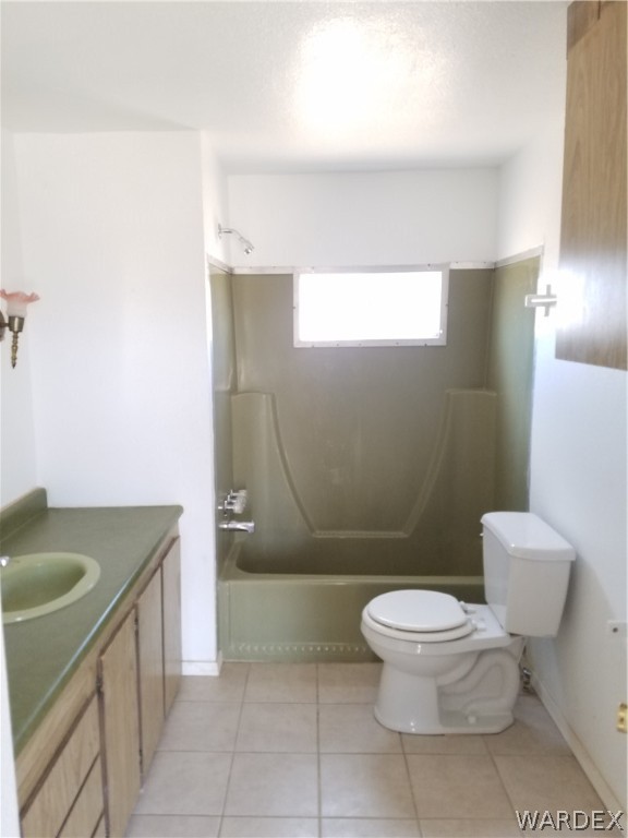 3645 Ligurta Road Golden Valley, AZ 86413 - Photo 6 of 17 Full bath with laminate counter, tile floor and tub/shower combo
