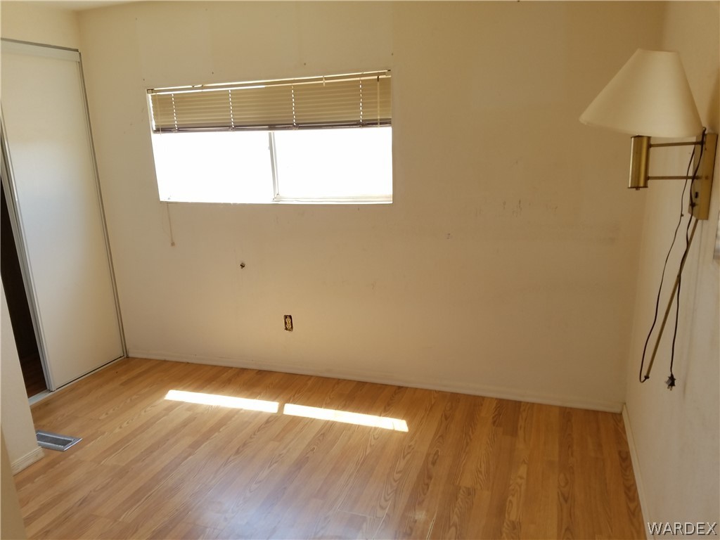 3645 Ligurta Road Golden Valley, AZ 86413 - Photo 7 of 17 Bedroom with 3/4 bath, laminate floor
