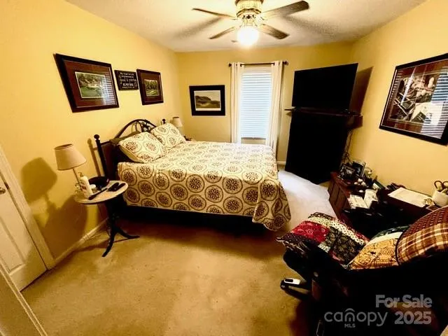 a bedroom with furniture and a bed