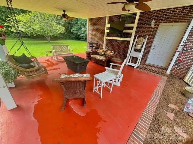 an outdoor space with furniture and garden