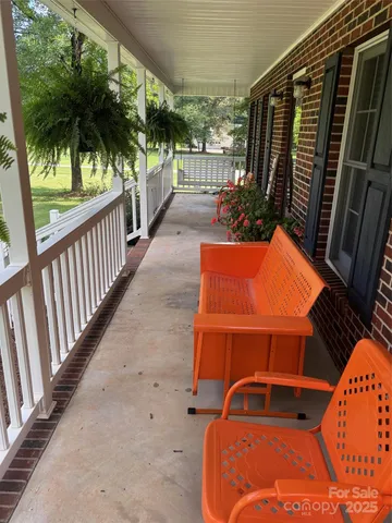 a view of a balcony with chairs