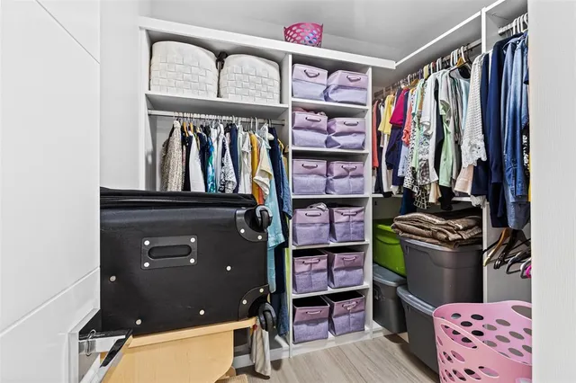 a bedroom with a bed and a desk