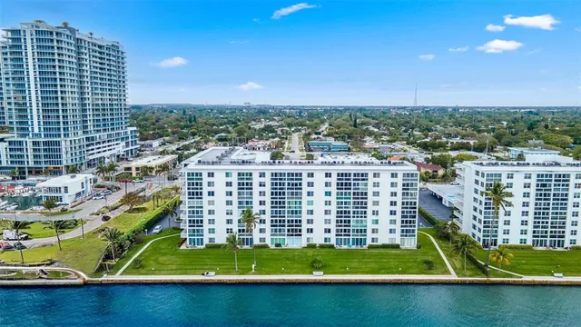 a view of a garden with a building in the background
