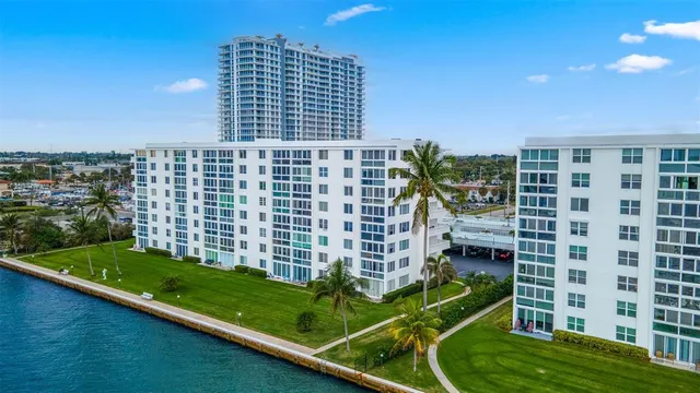 a view of a lake with table and chairs