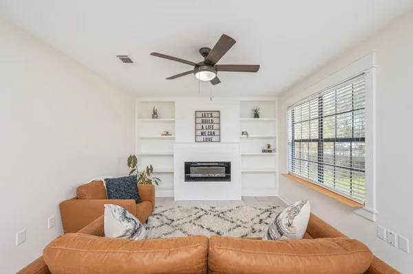 a living room with furniture and a window