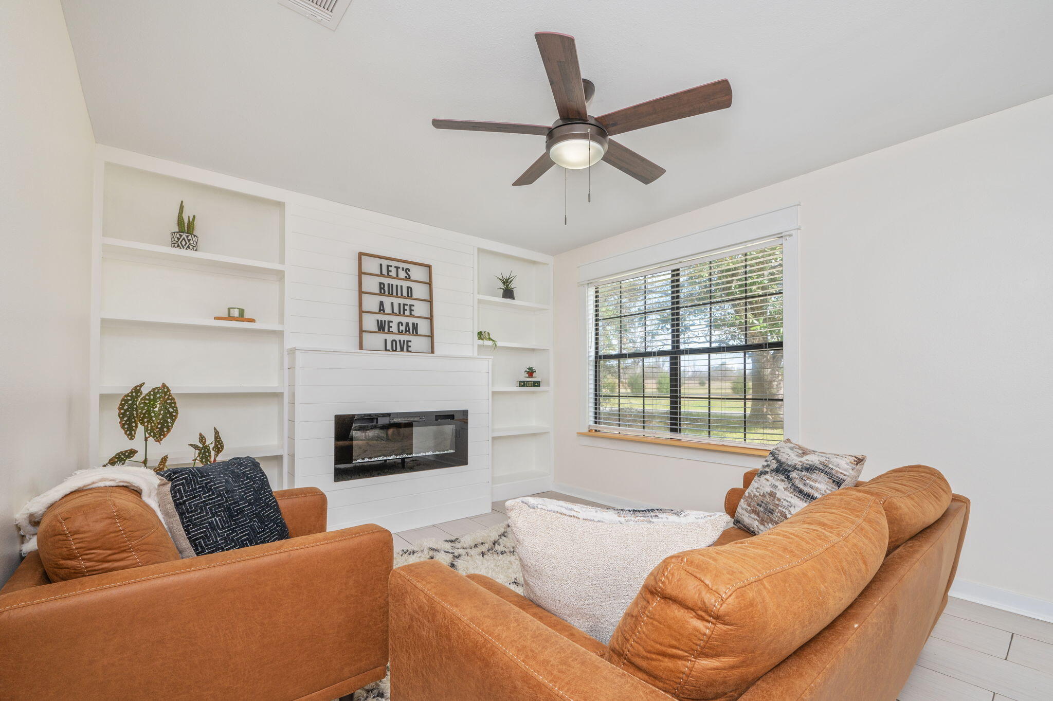 5816 Jack Stokes Road Baker, FL 32531 - Photo 4 of 16 a living room with furniture and a fireplace