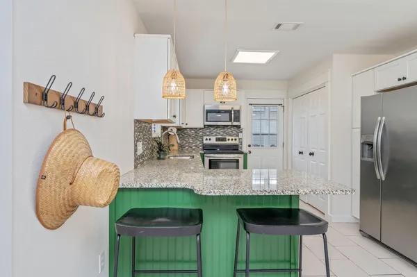 a bathroom with a sink a mirror and shower