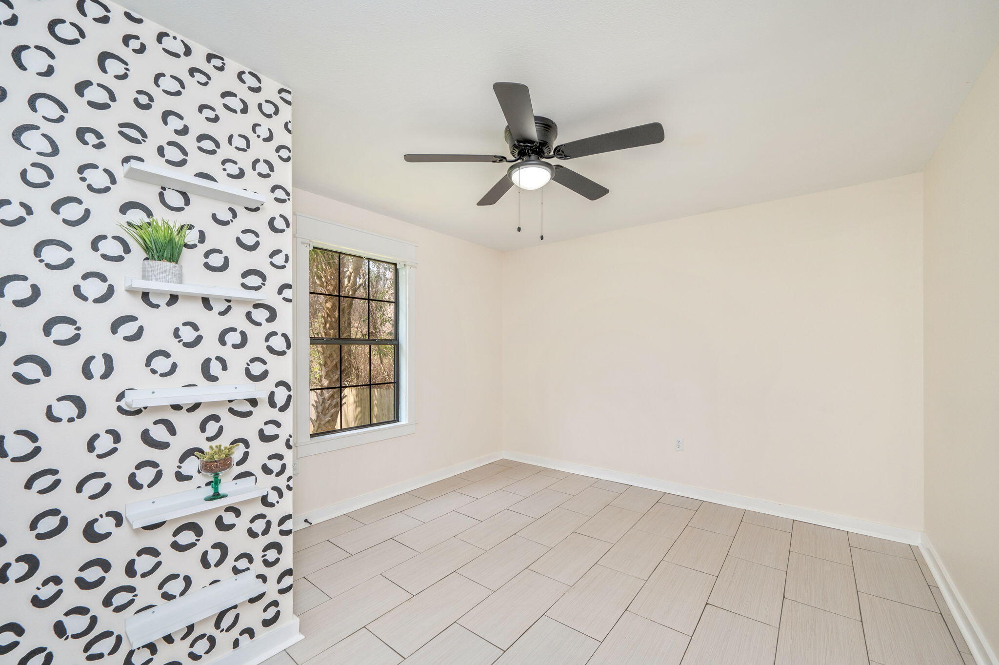 5816 Jack Stokes Road Baker, FL 32531 - Photo 9 of 16 a view of an empty room and window