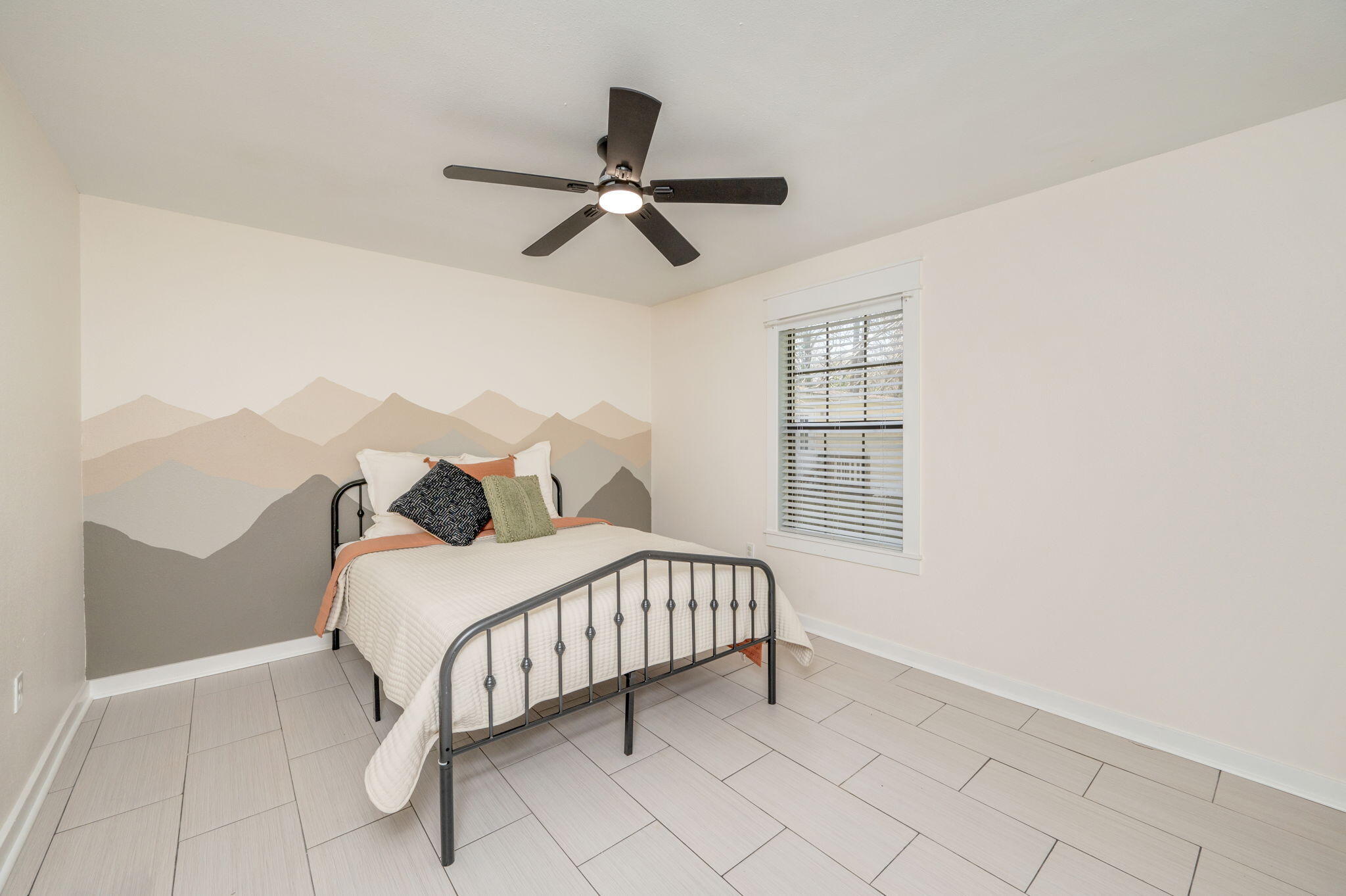 5816 Jack Stokes Road Baker, FL 32531 - Photo 10 of 16 a bedroom with a bed and a window