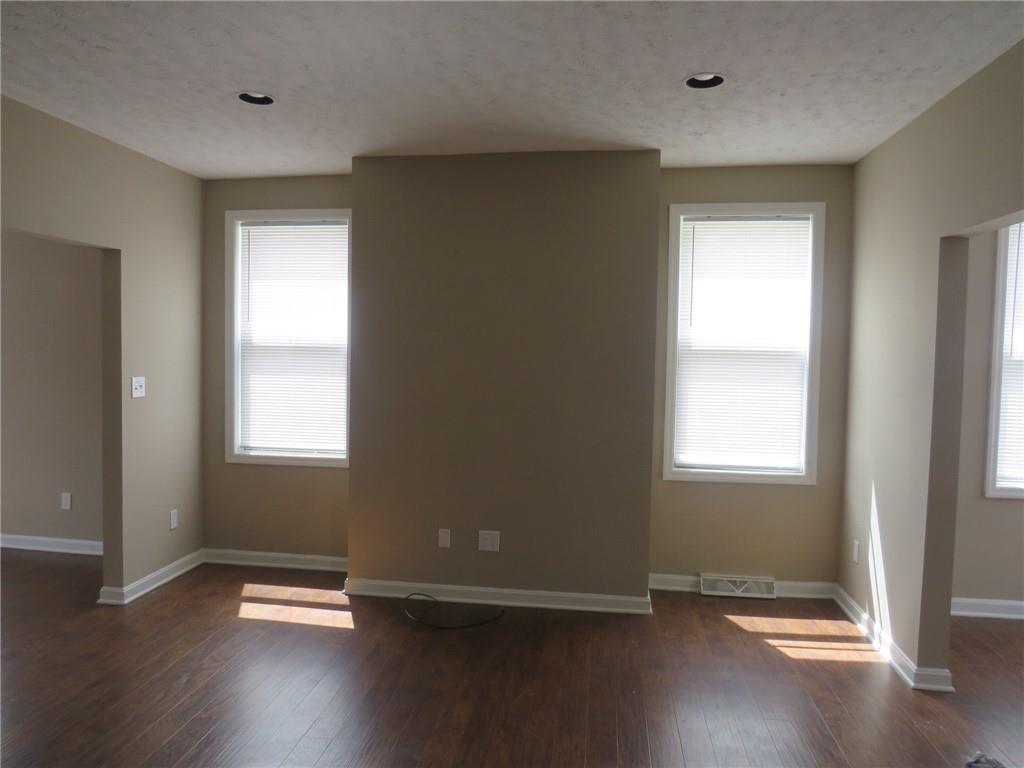 800 Liberty Street McKees Rocks, PA 15136 - Photo 3 of 36 an empty room with wooden floor and windows