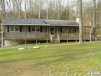 3025 Funks Mill Road Riegelsville, PA 18077 - Photo 1 of 5 a front view of a house with a garden