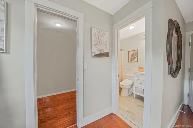 a bathroom with a toilet sink and shower