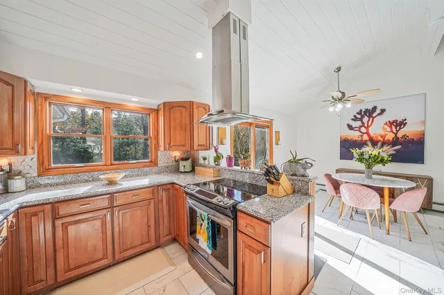 a kitchen that has a lot of cabinets in it