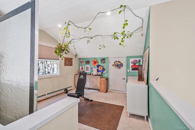 a view of a hallway with a dining table