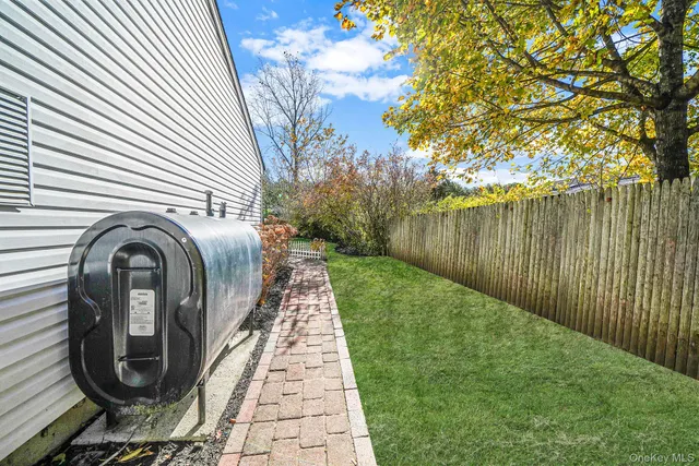 a view of a pathway with a wrought fence
