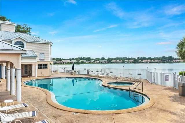 a view of a swimming pool with a lounge chair