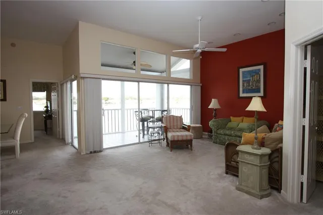 a lobby with furniture and floor to ceiling window