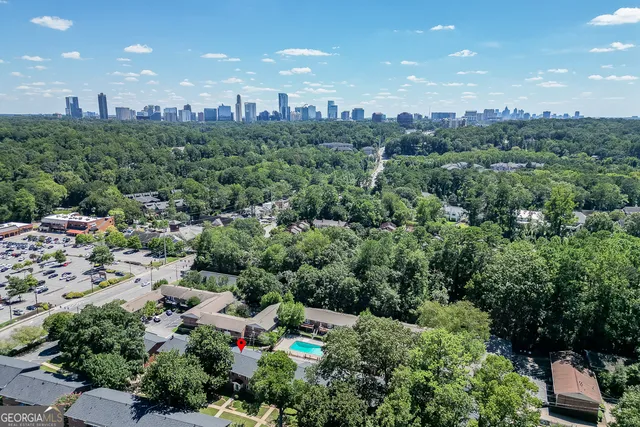 an aerial view of multiple houses with yard