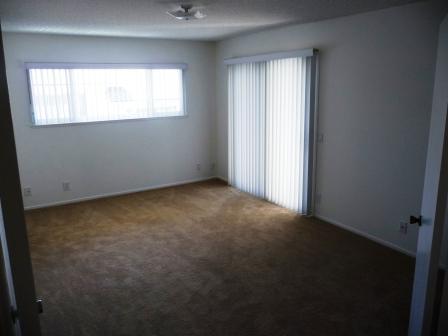 7560 Cathedral Oaks Road Goleta, CA 93117 - Photo 5 of 6 an empty room with windows