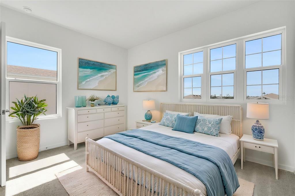 17024 Cottontail Circle Punta Gorda, FL 33982 - Photo 35 of 43 a bedroom with a large bed and a potted plant