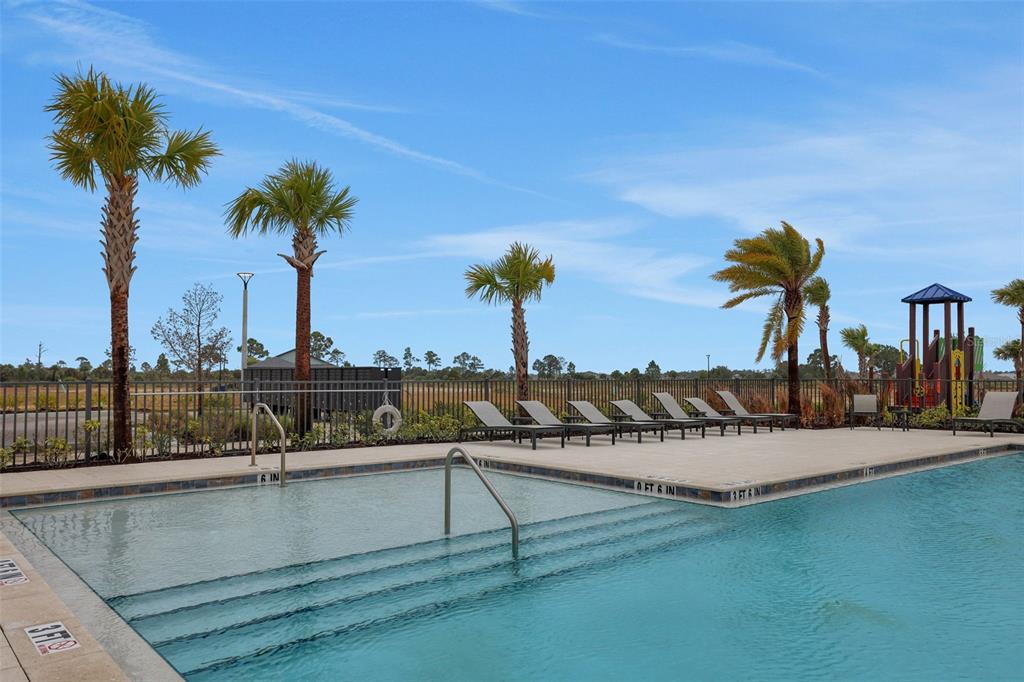 17024 Cottontail Circle Punta Gorda, FL 33982 - Photo 41 of 43 a view of a swimming pool with a table and chairs