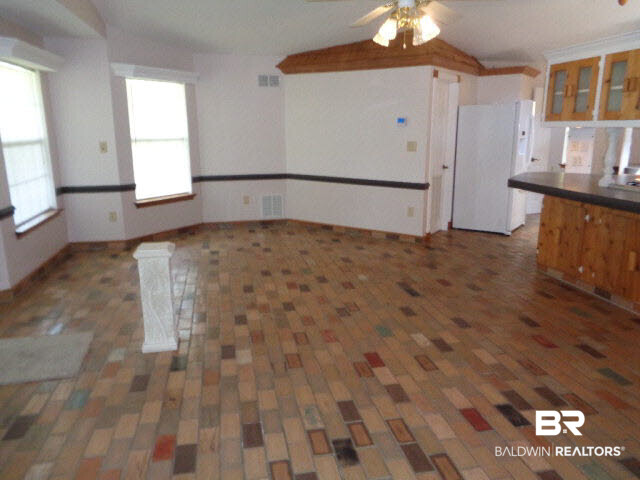 28202 Vargo Lane Elberta, AL 36530 - Photo 13 of 45 25 x 18. Brick floor. Ceiling fan/light. Chair rail.