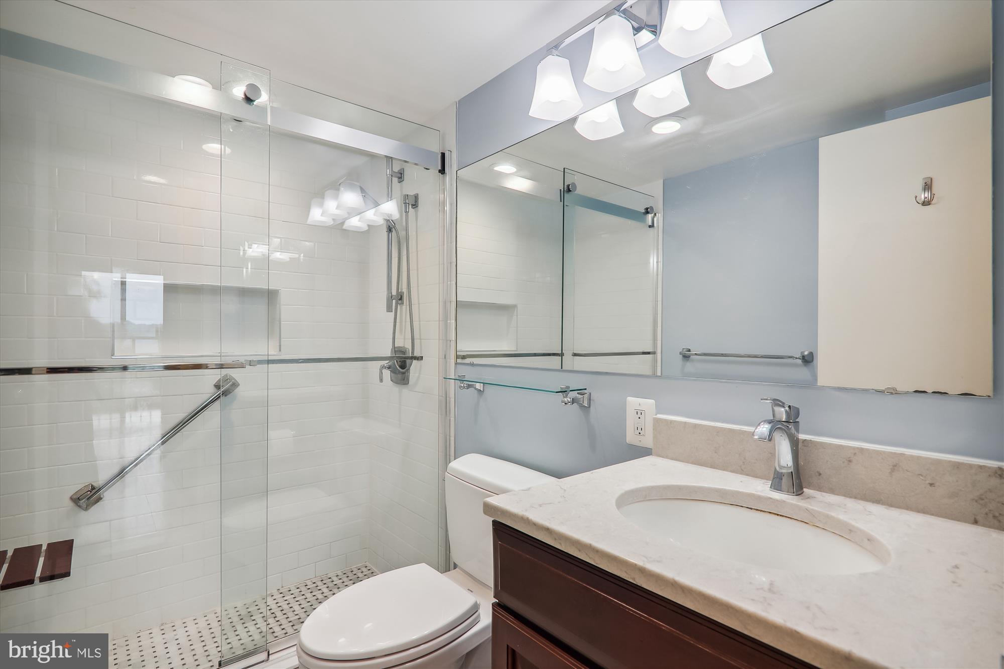 700 7th Street Southwest, Unit 701 Washington, DC 20024 - Photo 19 of 54 Primary Bathroom with a Glass Enclosed Shower