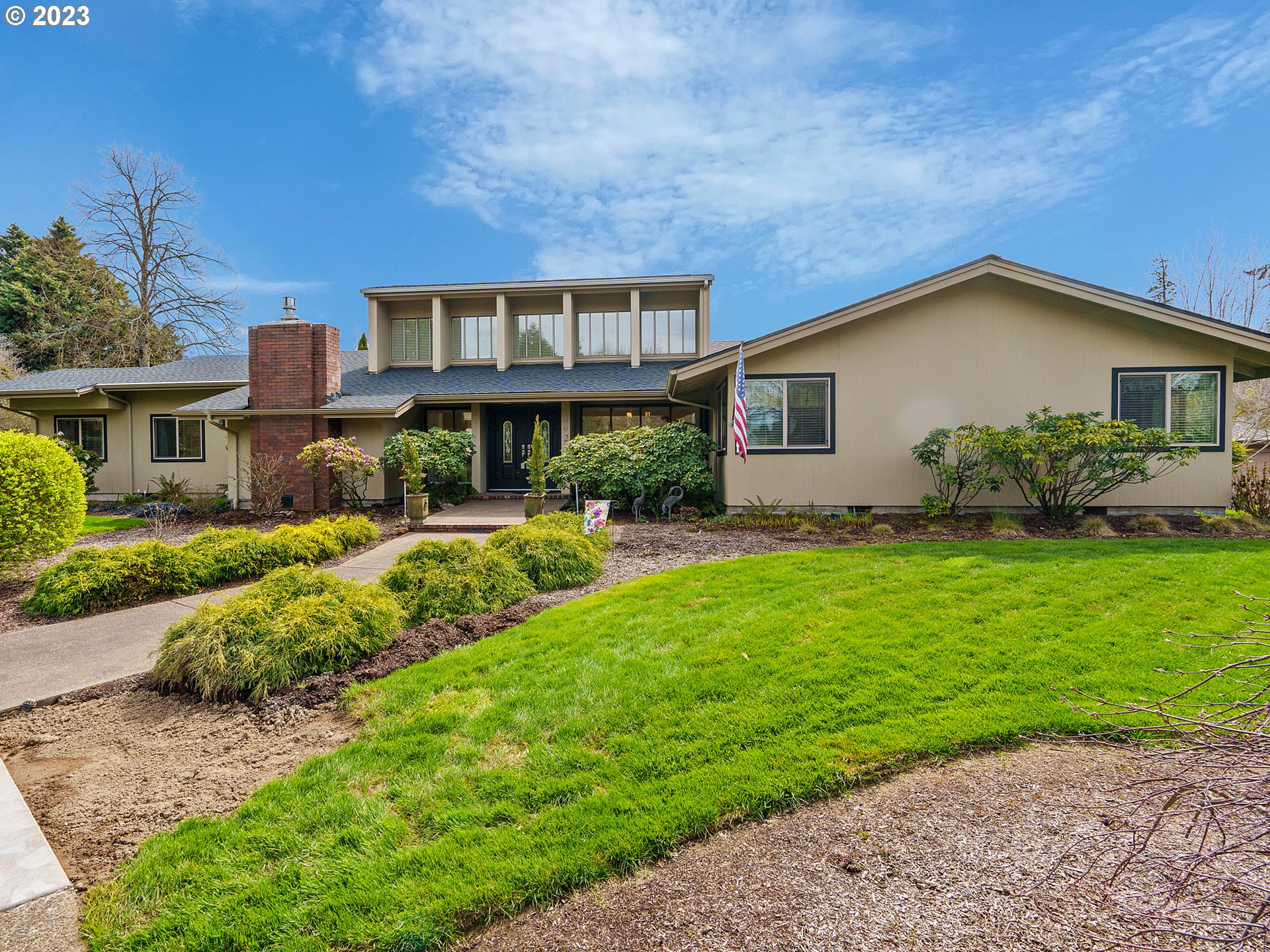 a front view of a house with garden