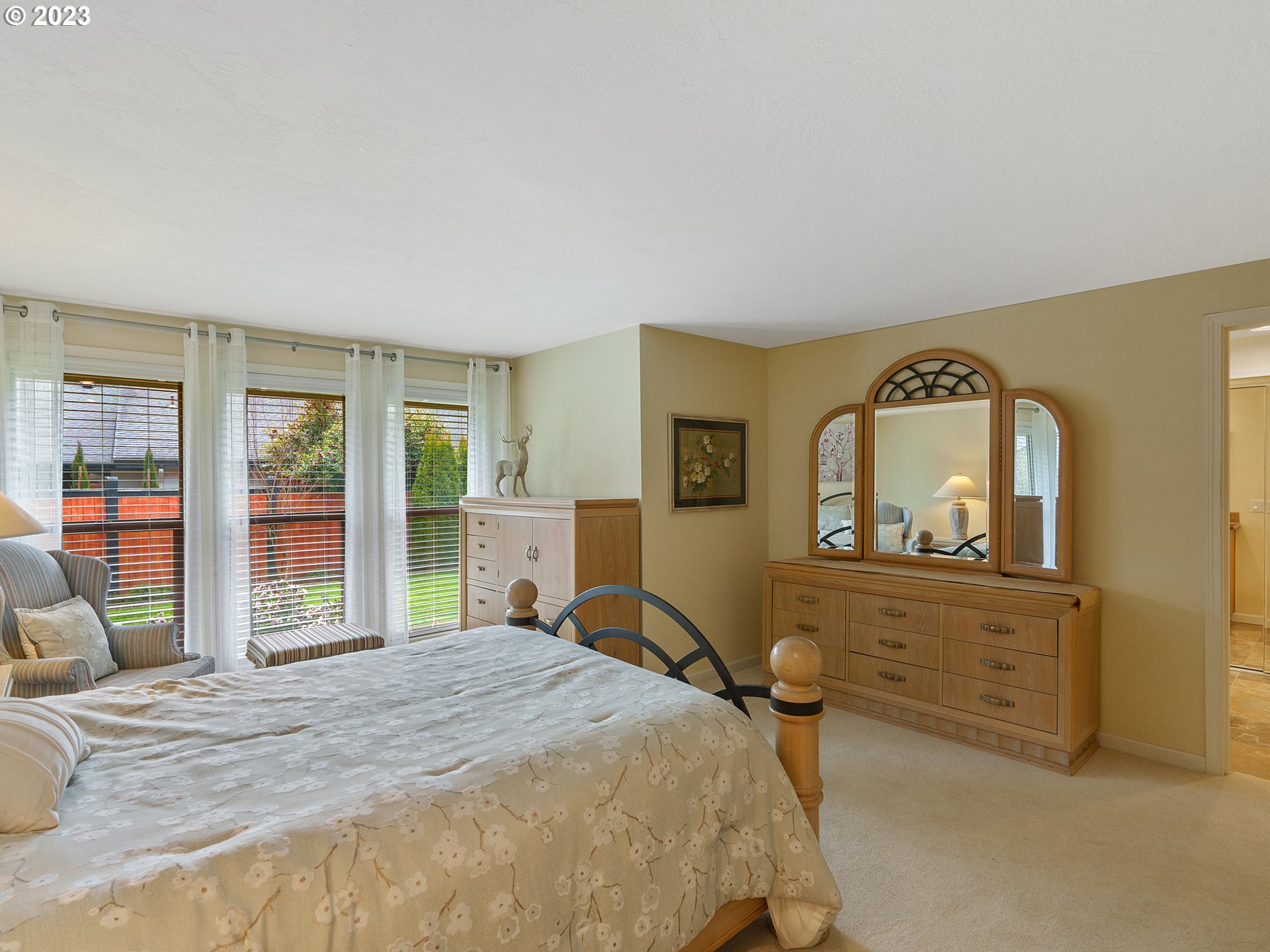 992 Spyglass Drive Eugene, OR 97401 - Photo 21 of 35 a bedroom with a bed and dresser with mirror