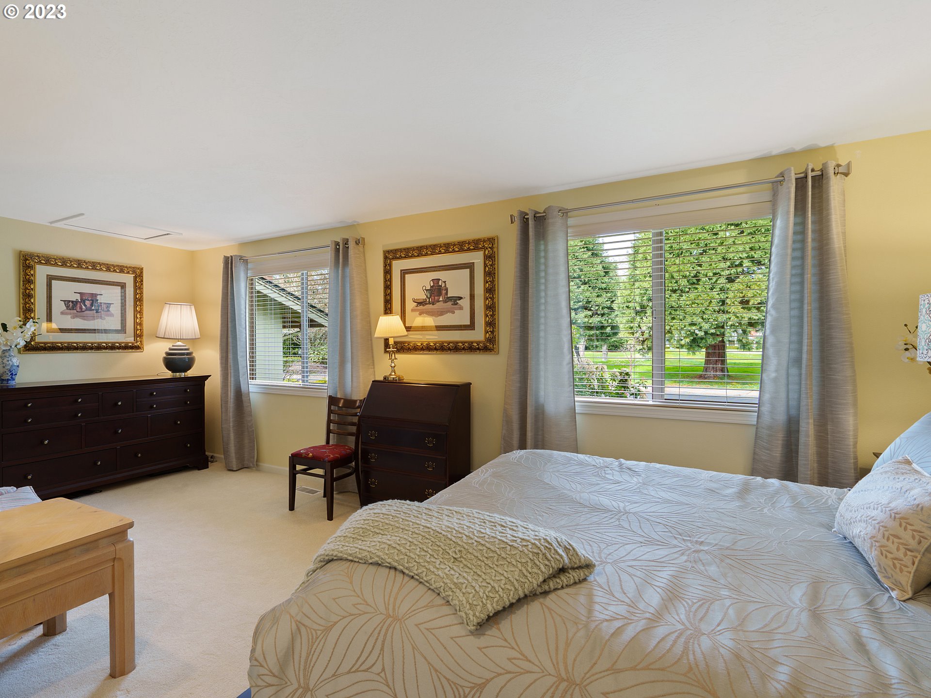 992 Spyglass Drive Eugene, OR 97401 - Photo 27 of 35 a bedroom with a bed dresser and a window