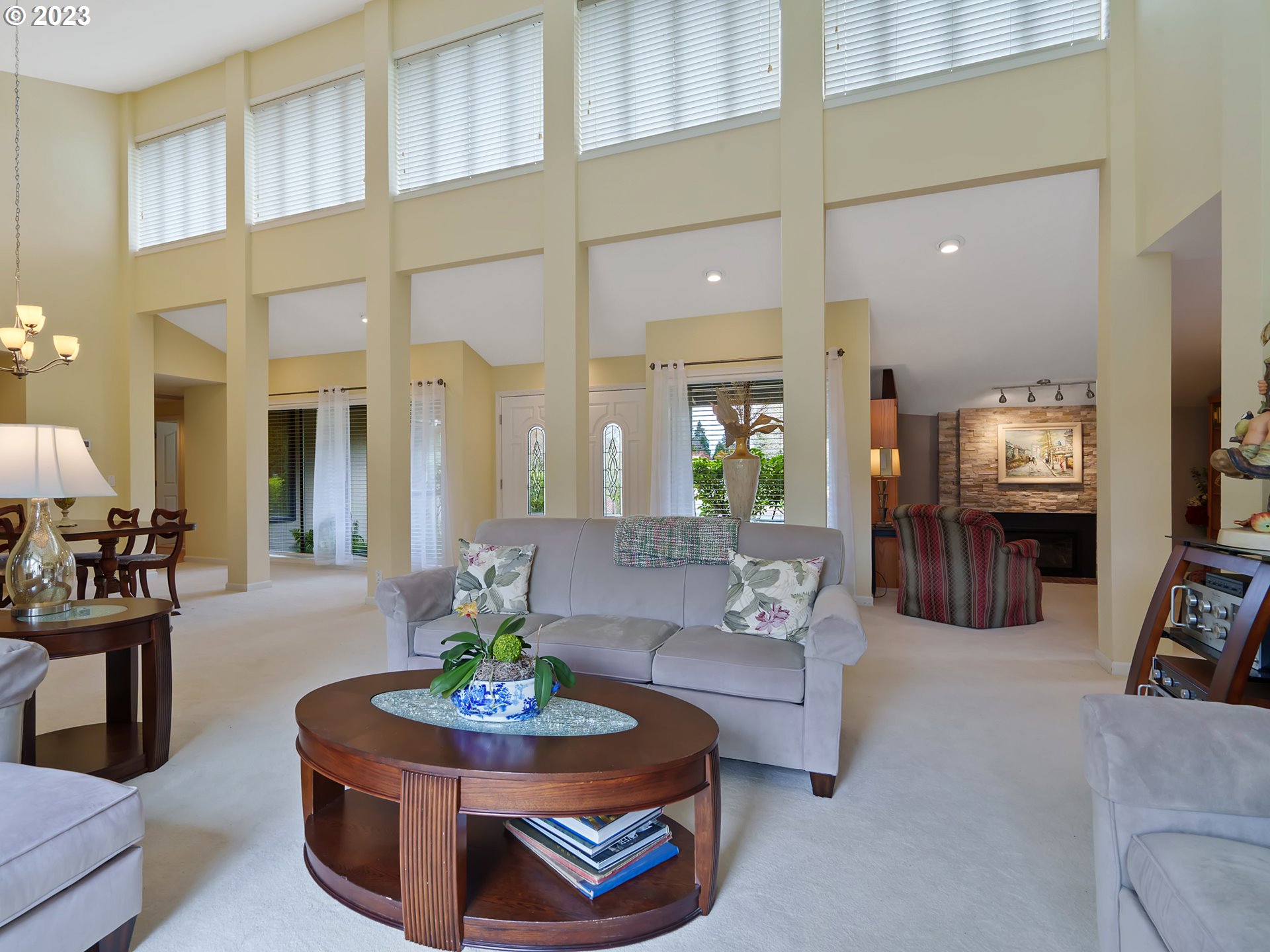 992 Spyglass Drive Eugene, OR 97401 - Photo 6 of 35 a living room with fireplace furniture and a flat screen tv