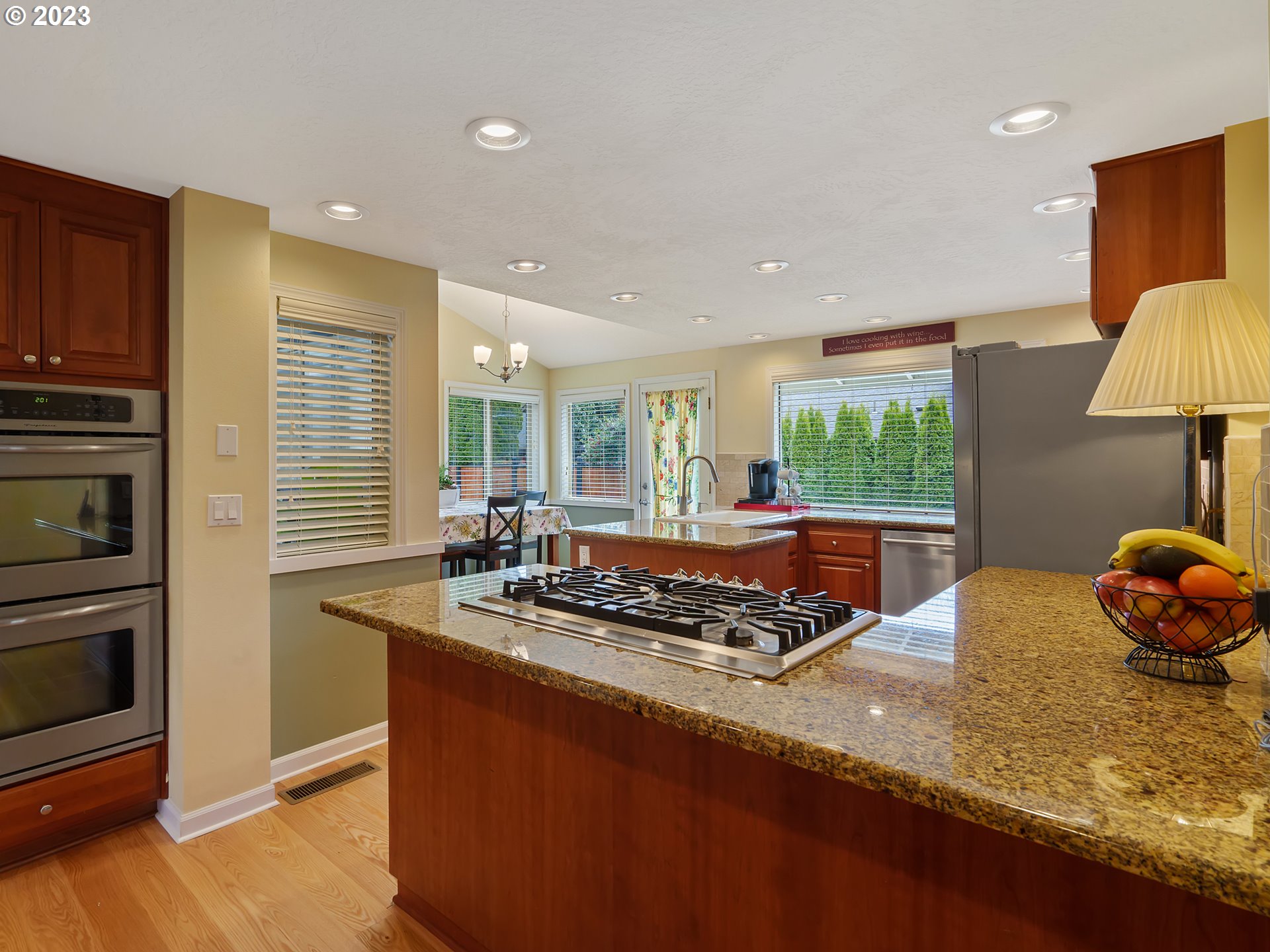 992 Spyglass Drive Eugene, OR 97401 - Photo 8 of 35 a kitchen with stainless steel appliances granite countertop a sink stove and refrigerator