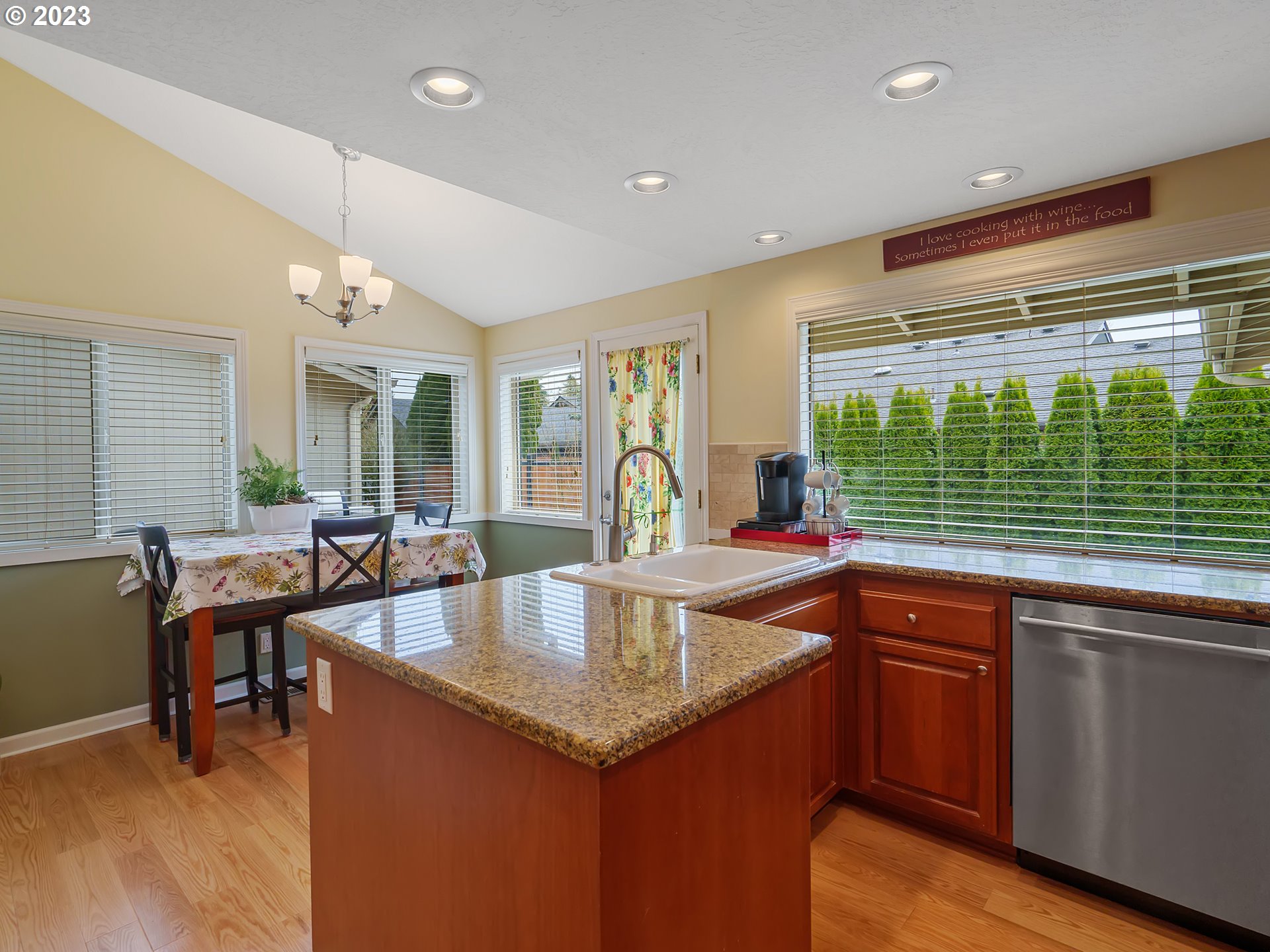 992 Spyglass Drive Eugene, OR 97401 - Photo 10 of 35 a kitchen with center island and windows