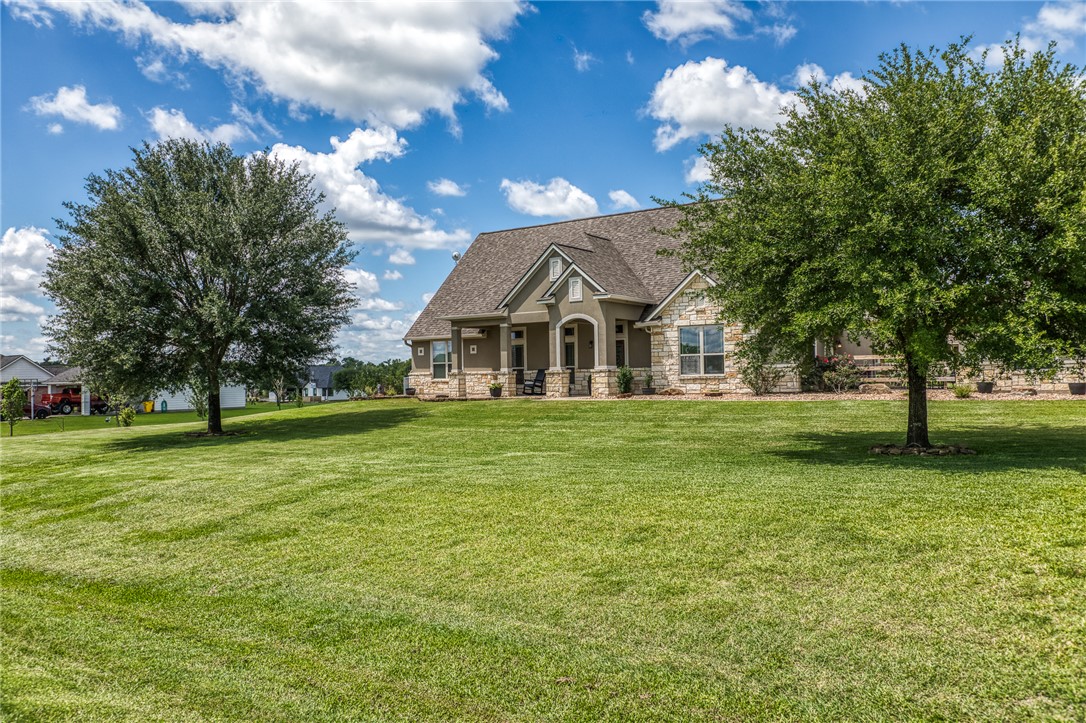 586 Ruby Drive Bellville, TX 77418 - Photo 4 of 50 a view of house with outdoor space and garden
