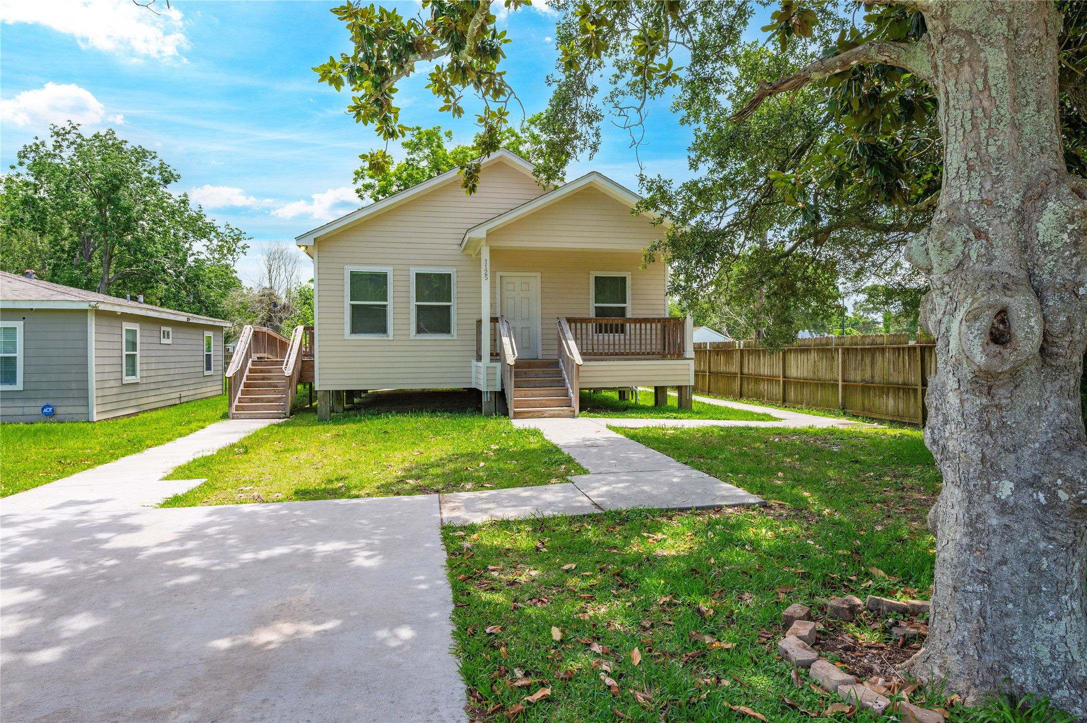 1125 Lake Road La Marque, TX 77568 - Photo 33 of 33 a view of a house with a yard and a patio