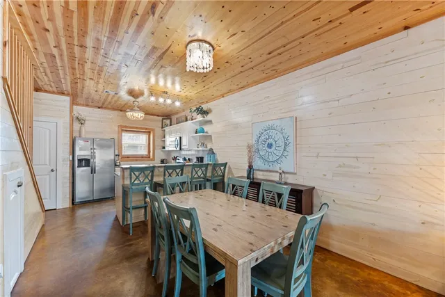 a kitchen with cabinets and stainless steel appliances
