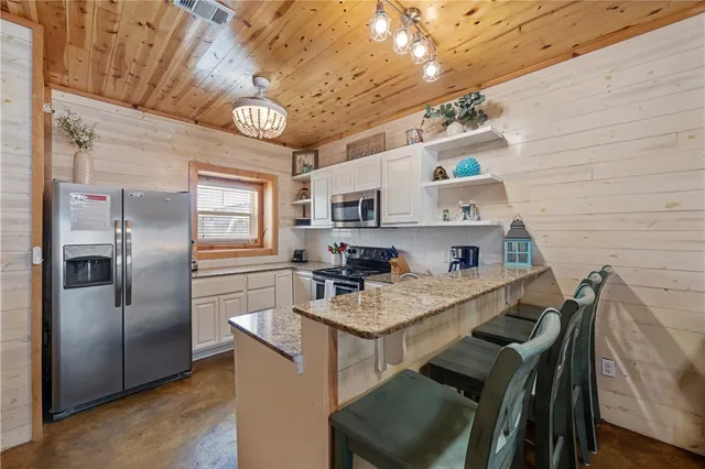 a bedroom with a bed and a ceiling fan