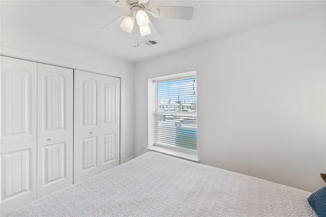 a front view of a house with garden and sitting area